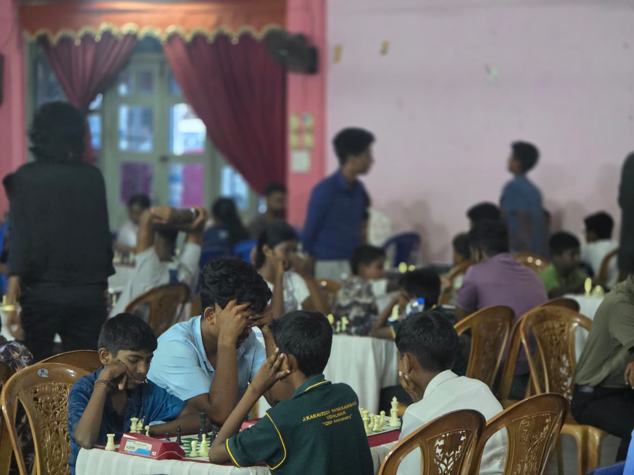 Tournament games in progress across the hall